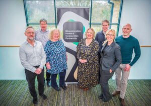 From left to right: Keith Gerrard, Director of Communities, Stroud District Council; Mark McEgan, Operations Director, Rooftop Housing Group; Caroline Walker, Director of Housing, Customer and Community Services, Cheltenham Borough Council Housing Services; Ruth Cooke, Chief Executive Officer, GreenSquareAccord; Robert Nettleton, Chief Executive Officer, Bromford; Hayley Selway, Chief Executive Officer, Two Rivers Housing; and Guy Stenson, Chief Executive Officer, Gloucester City Homes.